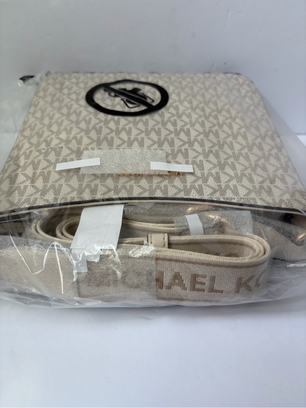 Michael Kors Jet Set Travel Small Signature Logo Messenger Bag in Cream color